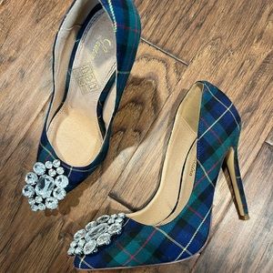 Womens plaid jeweled pumps.